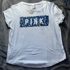 White short sleeve. Black background/blue flowers